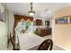 Dining room with a view of the kitchen and sliding glass doors to the backyard at 470 Cardinal Ct, Kissimmee, FL 34759