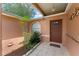 Inviting front entrance with a tiled porch and a cozy, landscaped garden area at 470 Cardinal Ct, Kissimmee, FL 34759