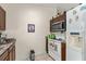 Efficient kitchen layout featuring essential appliances and ample cabinet space at 470 Cardinal Ct, Kissimmee, FL 34759