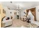 Cozy living room featuring tile floors, decorative accents, and a large window at 470 Cardinal Ct, Kissimmee, FL 34759