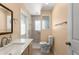 Bright bathroom featuring a new vanity top, decorative mirror, and tile shower with updated fixtures at 473 Burnt Tree Ln, Apopka, FL 32712
