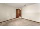 Bedroom with carpeted floors, a closet with a paneled door, and an entrance to an adjoining room at 473 Burnt Tree Ln, Apopka, FL 32712