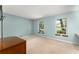 This spacious bedroom is light and bright with dual windows providing backyard views at 473 Burnt Tree Ln, Apopka, FL 32712
