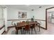 Elegant dining room with modern lighting and decor, perfect for intimate gatherings and Gathering meals at 473 Burnt Tree Ln, Apopka, FL 32712
