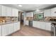 Bright kitchen featuring stainless steel appliances, granite countertops, and a stylish tile backsplash at 473 Burnt Tree Ln, Apopka, FL 32712