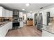 Modern kitchen with stainless steel appliances and updated cabinetry provides a functional and stylish space at 473 Burnt Tree Ln, Apopka, FL 32712