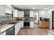 Modern kitchen featuring stainless steel appliances, granite countertops, and tile backsplash at 473 Burnt Tree Ln, Apopka, FL 32712