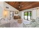 Inviting living room offers seamless access to the pool area and features modern furnishings and decor at 473 Burnt Tree Ln, Apopka, FL 32712