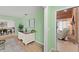 Bright living room featuring wood floors, light green walls, and plenty of natural light at 473 Burnt Tree Ln, Apopka, FL 32712