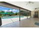 Covered patio with tile flooring, ceiling fan and view of the beautiful in-ground pool and backyard at 473 Burnt Tree Ln, Apopka, FL 32712