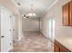 Open dining area with neutral colors, ceramic tile, and plenty of room for entertaining at 512 Bella Rosa Cir, Sanford, FL 32771