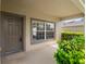 Inviting front porch with a window and a nicely painted door, providing a warm welcome at 512 Bella Rosa Cir, Sanford, FL 32771