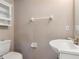 Powder room features a toilet, vanity, and mirrored wall cabinet at 512 Bella Rosa Cir, Sanford, FL 32771