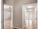 Open hallway with tile flooring leading to other rooms and doorways at 512 Bella Rosa Cir, Sanford, FL 32771