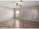 Bright living room with neutral paint, ceiling fan, and tile flooring at 512 Bella Rosa Cir, Sanford, FL 32771