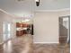 Open floor plan showing a kitchen and living space with tile flooring at 512 Bella Rosa Cir, Sanford, FL 32771