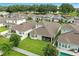 An aerial view of the backyard showcasing its size, privacy fence, and patio, surrounded by other homes at 5314 Golden Apple Dr, Winter Garden, FL 34787