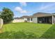 Large backyard with a privacy fence, perfect for outdoor activities and gatherings at 5314 Golden Apple Dr, Winter Garden, FL 34787