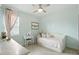 This bedroom features a daybed and vanity, creating a comfortable and functional space at 5314 Golden Apple Dr, Winter Garden, FL 34787
