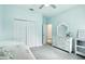 This bedroom features soft blue walls, a bed, and a dresser, creating a serene and inviting atmosphere at 5314 Golden Apple Dr, Winter Garden, FL 34787