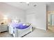 This bedroom features a white bedframe and light-colored walls, creating a serene and inviting atmosphere at 5314 Golden Apple Dr, Winter Garden, FL 34787