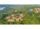 Overhead view displays luxurious homes situated amongst lush greenery and tranquil settings at 5413 Via Veneto Ct, Sanford, FL 32771