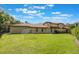 Expansive backyard with lush lawn and privacy hedges, plus a soccer goal at 5413 Via Veneto Ct, Sanford, FL 32771