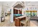 Stylish bar area with custom cabinetry, granite countertops, and pendant lighting at 5413 Via Veneto Ct, Sanford, FL 32771