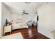 Bright bedroom featuring wood floors, natural light, and a vanity area at 5413 Via Veneto Ct, Sanford, FL 32771