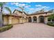 Lovely home with a three-car garage and brick-paved driveway at 5413 Via Veneto Ct, Sanford, FL 32771