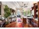 Executive office with hardwood floors, custom wood shelving, and a large desk space, ideal for productivity at 5413 Via Veneto Ct, Sanford, FL 32771