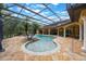 Large screened pool area features a wading pool and ample deck space at 5413 Via Veneto Ct, Sanford, FL 32771