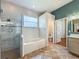 Bathroom featuring soaking tub, tiled shower, and view to the toilet room at 5489 Glen Oak Place, Sanford, FL 32771