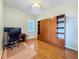 Office space with hardwood floors and built in storage and shelving at 5489 Glen Oak Place, Sanford, FL 32771