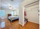 Comfortable bedroom with hardwood floors and a view into a closet at 5489 Glen Oak Place, Sanford, FL 32771