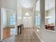 Inviting foyer with tiled floor and view to the living and dining areas at 5489 Glen Oak Place, Sanford, FL 32771