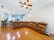 Open concept living room and kitchen area featuring hardwood floors, natural light, and ample seating at 5489 Glen Oak Place, Sanford, FL 32771
