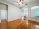 Spacious open-concept layout with gleaming hardwood floors and neutral decor at 5489 Glen Oak Place, Sanford, FL 32771