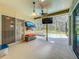 Outdoor patio with a ceiling fan, mounted TV, furniture, and a view of the pool at 5489 Glen Oak Place, Sanford, FL 32771