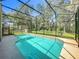 Relaxing screened-in pool, perfect for entertaining or enjoying a refreshing swim at 5489 Glen Oak Place, Sanford, FL 32771