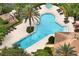 Aerial view showcasing a community pool, hot tub, palm trees, sundeck, and seating at 661 Hangnest Ln, Lake Mary, FL 32746