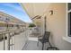 Relaxing balcony area features a metal chair, offering an inviting outdoor space to enjoy fresh air and natural light at 661 Hangnest Ln, Lake Mary, FL 32746