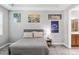 Comfortable bedroom featuring neutral tones, soft carpet, and tasteful wall decor at 661 Hangnest Ln, Lake Mary, FL 32746