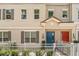 Townhouse exterior showcasing neutral paint, decorative shutters, and covered entryways at 661 Hangnest Ln, Lake Mary, FL 32746