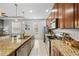 Spacious kitchen with stainless steel appliances, granite counters, and an open layout at 661 Hangnest Ln, Lake Mary, FL 32746