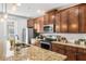Modern kitchen boasting granite countertops, stainless steel appliances, and ample cabinet space at 661 Hangnest Ln, Lake Mary, FL 32746