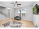Bright living room space with a comfortable sofa and large windows at 661 Hangnest Ln, Lake Mary, FL 32746
