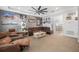Bright living room featuring a ceiling fan, comfortable seating, and tasteful decor on the walls at 661 Hangnest Ln, Lake Mary, FL 32746