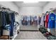 Spacious walk-in closet with ample shelving and rod space for organized storage at 661 Hangnest Ln, Lake Mary, FL 32746