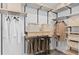 Walk-in closet featuring custom shelving for clothes and accessories at 7432 Olivewood Ave, Orlando, FL 32829